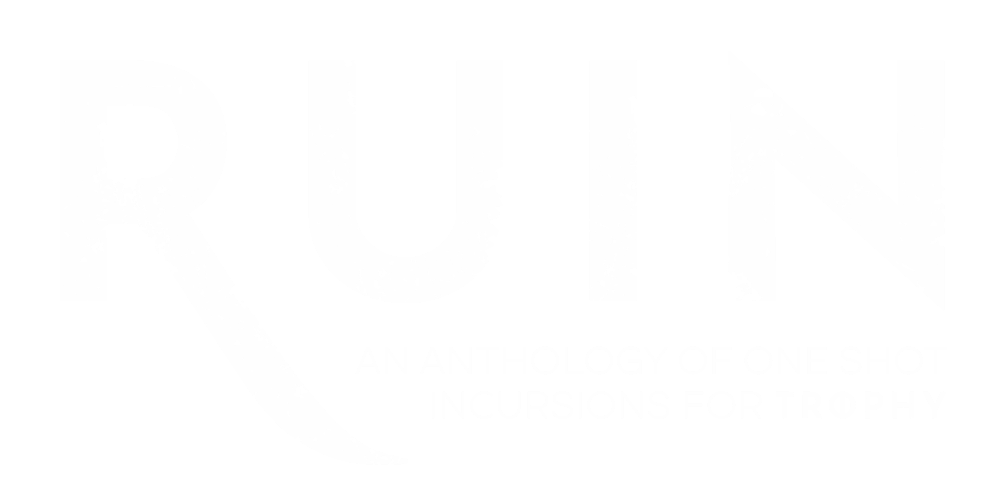 Mock Up of Ruin A hardcover book on a desk surrounded by gadgets (for playing Trophy online, probably!)